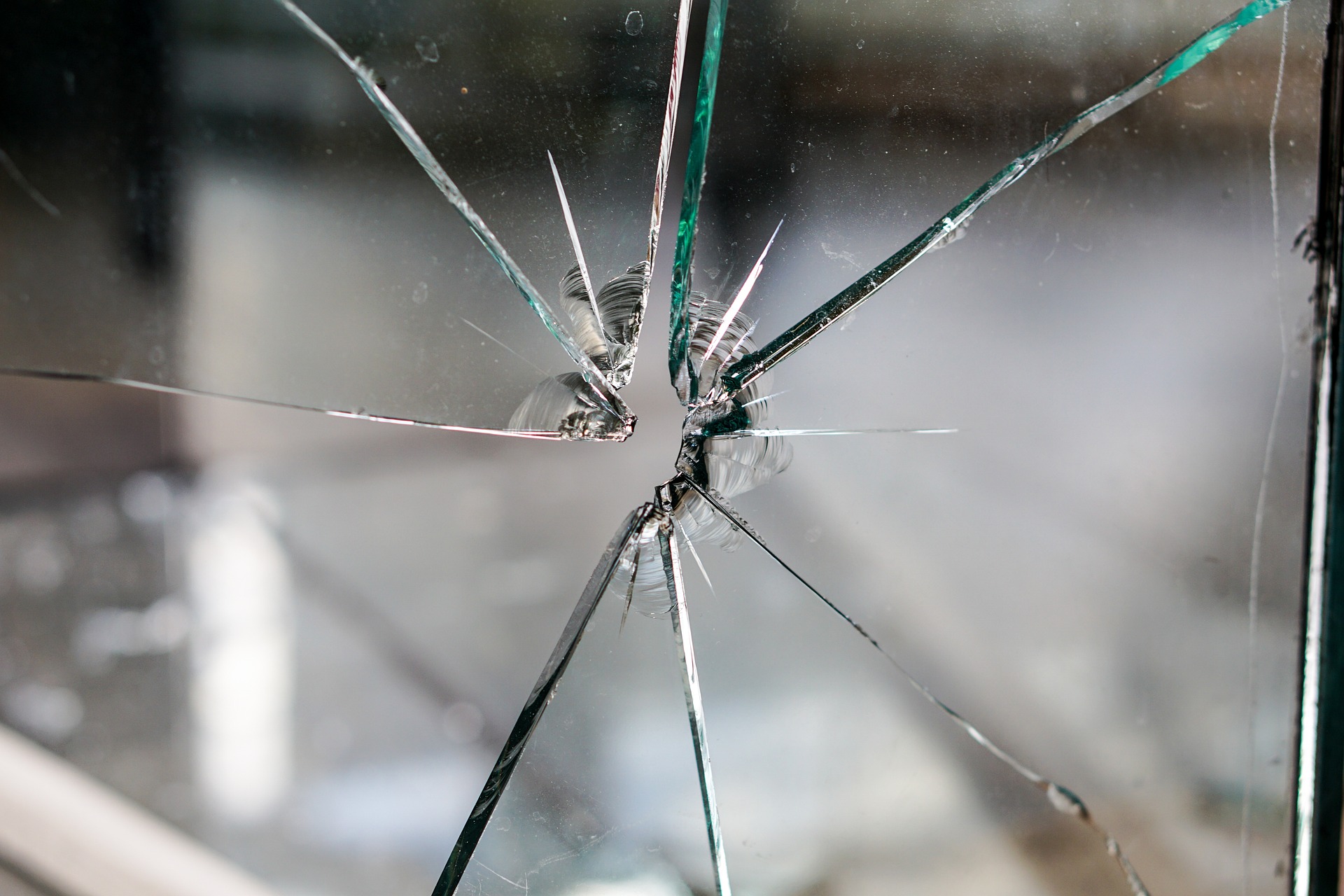 Bullet hole in glass representing Crime Promos.